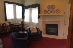 queen suite, fireplace, lounge chairs, scenic view