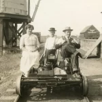 family riding in old modal t car