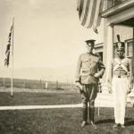 Colonel Heigho and young man in band suit