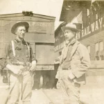 Two men at a train station