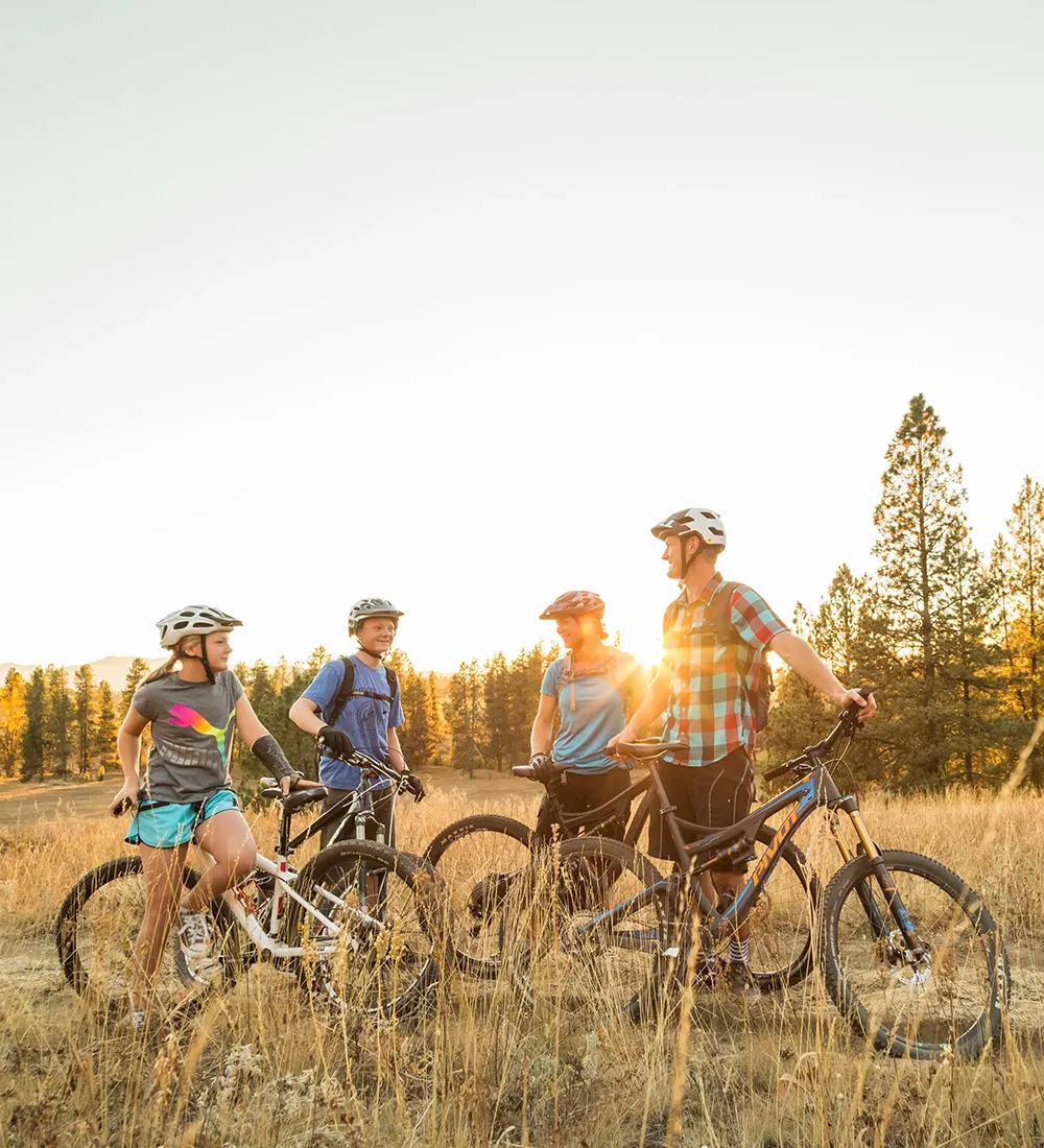 Family taking a break after mountain bike ride