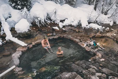 A couple relaxing in Trail Creek Hot Springs