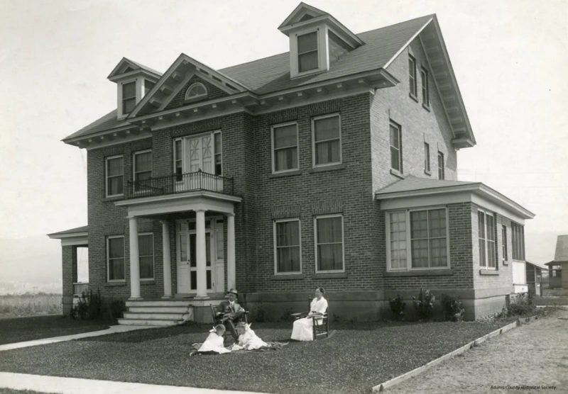 Heigho Family in front of mansion