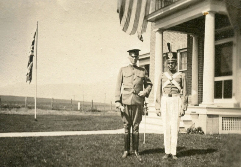 Colonel Heigho and young man in band suit