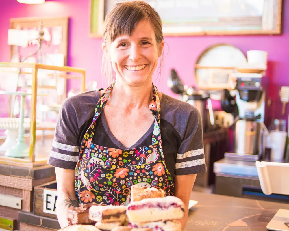 waitress servicing cake at Stacy's Cake