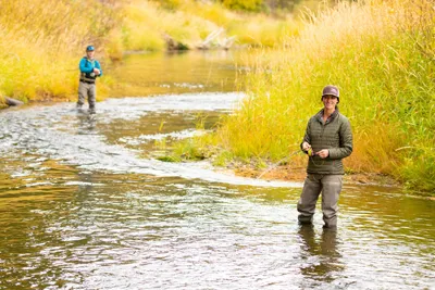 couple fishing in a river