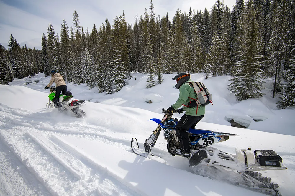 couple snow biking