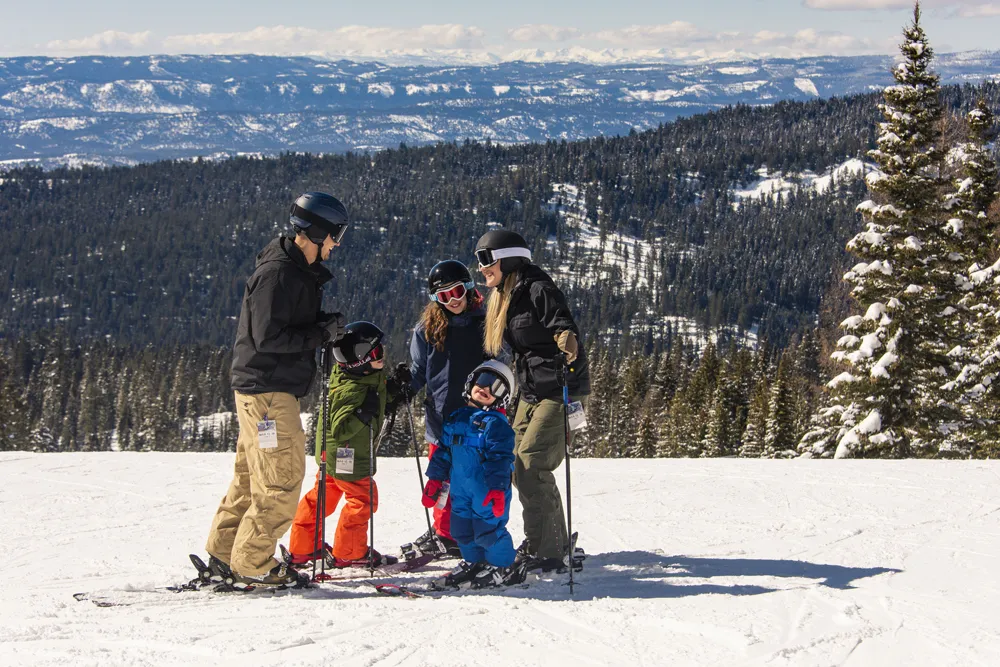 family skiing together