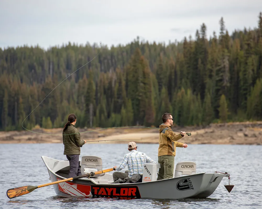 three fishers in boat